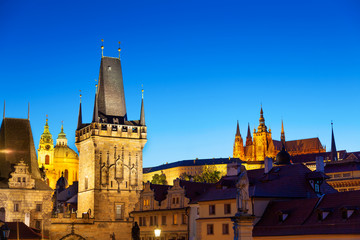 Fototapeta na wymiar Twilight scene of Prague with Charles bridge tower and St Vitus