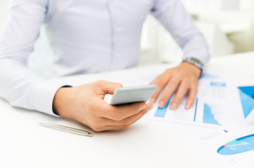 close up of businessman with smartphone