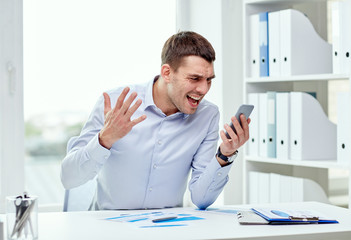 close up of businessman with smartphone