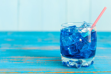 Blue Lagoon cocktail on light background, with empty space for