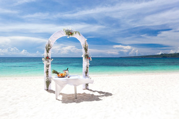 Beautiful wedding arch on tropical beach