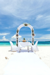 Beautiful wedding arch on tropical beach