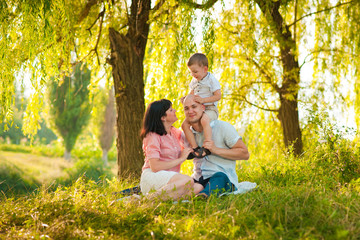 Fototapeta premium Happy joyful young family with child