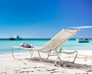 Chaise longue on  beach