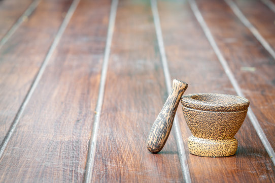 wood mortar on wood background