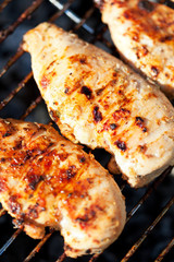 Grilled chicken breast on barbeque