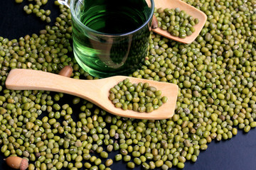 green beans dried and water chlorophyll on black background.