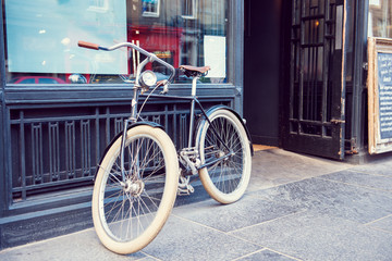 Fototapeta na wymiar Old bike on the streets of an European city.
