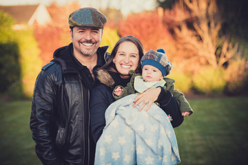 Young chilean family at the garden.