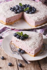 Homemade blueberry cheesecake with fresh berries closeup. Vertical
