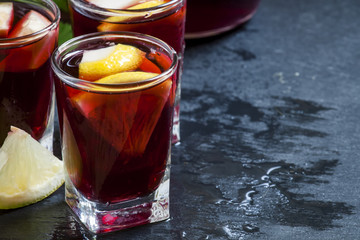 Red wine with lemon and orange, selective focus