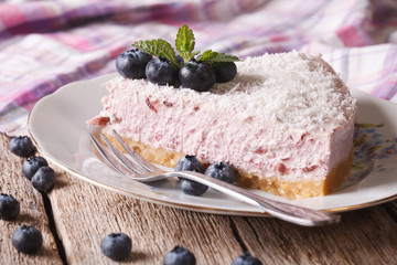 piece of blueberry cheesecake with coconut closeup. Horizontal
