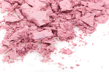 Crushed eyeshadows on white background