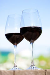 Two glasses with red wine, outside