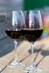 Fotobehang Two glasses with red wine, outside © photopixel