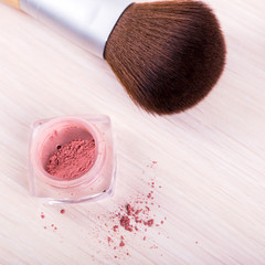 make up brush with red powder