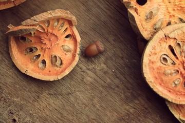 Slices of dried bael fruit and juice