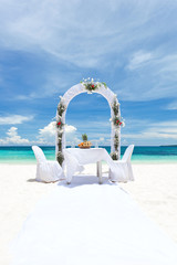 Beautiful wedding arch on tropical beach