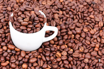 White cup with coffee beans