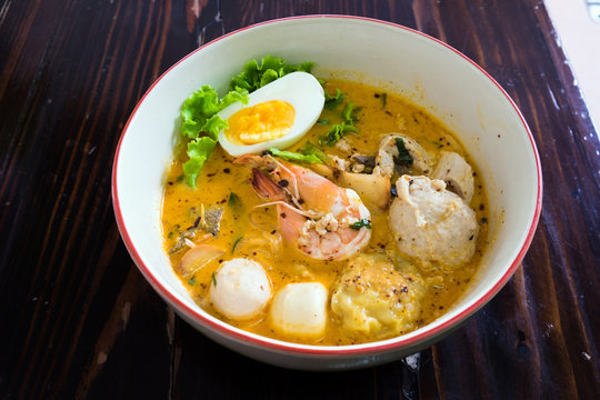 Asian noodle with seafood and egg in the tomyum soup