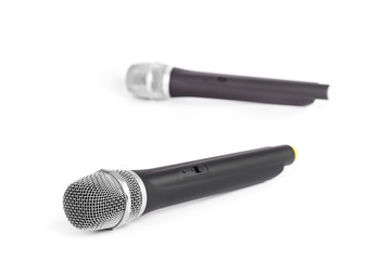 Two wireless microphones closeup on white background