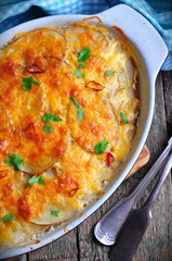 potato casserole with chicken, onions and cheese