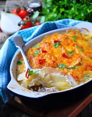 potato casserole with chicken, onions and cheese
