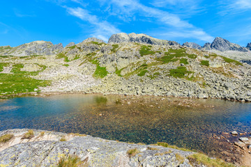 View of beautiful alpine lake in summer landscape of Starolesna valley, High Tatra Mountains, Slovakia