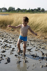 Boy goes on healing mud