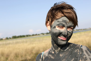 Woman with healthy mud face