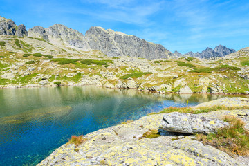 Naklejka na ściany i meble View of beautiful alpine lake in summer landscape of Starolesna valley, High Tatra Mountains, Slovakia
