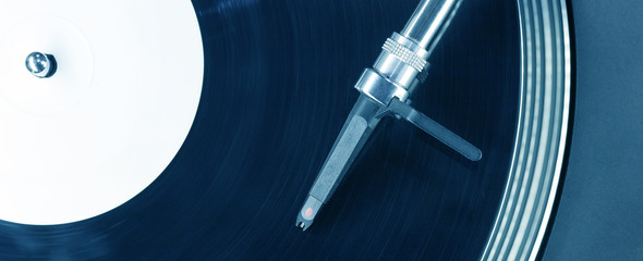 Dj needle stylus on spinning record