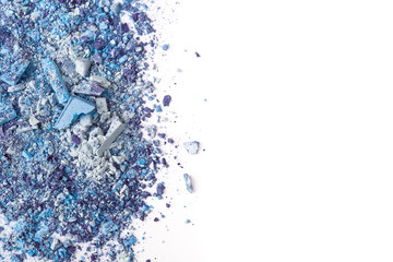 Crushed eyeshadows on white background