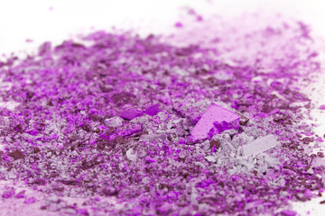 Crushed eyeshadows on white background