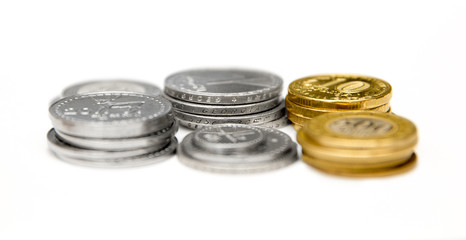 Stacks of Russian, Georgian and Armenian coins on a white background