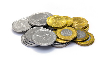 Stacks of Russian, Georgian and Armenian coins on a white background