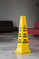 Yellow sign caution wet floor