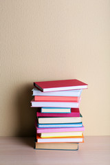 Stack of books on shelf.