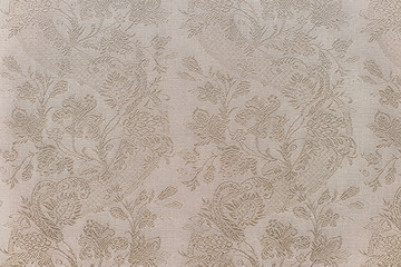 Old rough fabric with flowers, textile background