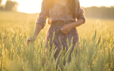 Silhouette of a girl on the background of wheat ears © tanya_ischenko