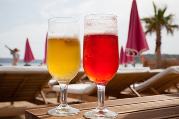 Two glasses of cold beer in the beach bar