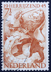 NETHERLANDS - CIRCA 1945: a stamp printed in the Netherlands shows Lion and Dragon, Liberation of Netherlands, Rising Again, circa 1945