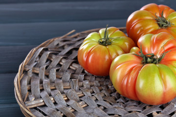 Green tomatoes on table close up