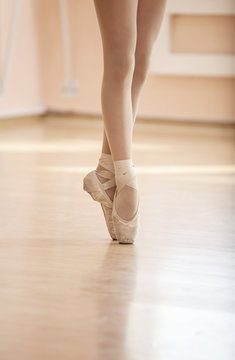 Legs of young ballerina, ballet dancing class 