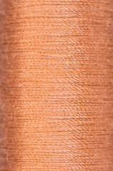 bobbin of brown thread