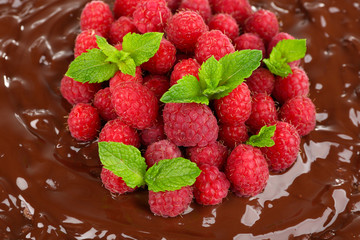 Cake with Chocolate Glaze and raspberries close-up