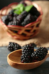 Ripe blackberry on wooden background