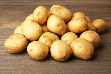 New potatoes on wooden background