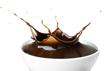 Splash of hot chocolate in cup isolated on white
