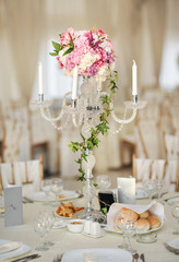 Antique candlestick with wedding bouquet